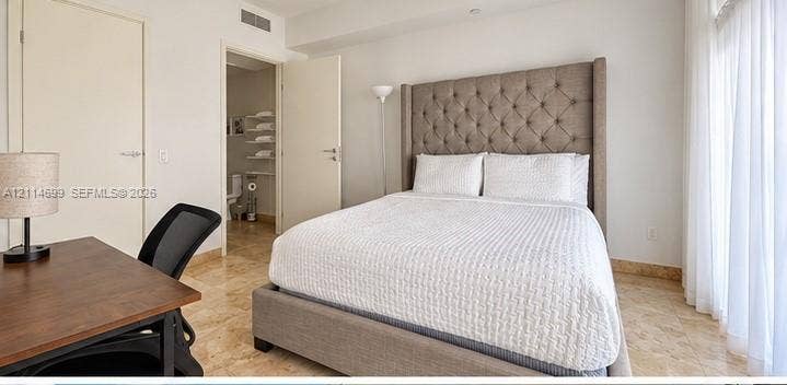 1300 Brickell Bay Drive, #3007, Miami, FL 33131 Stone-finish flooring and neutral-toned walls throughout
