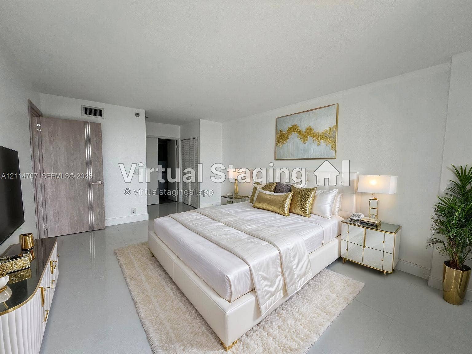 3300 NE 191st Street, #1405, Aventura, Aventura, FL 33180 Neutral-toned interior space featuring polished tile flooring, smooth wall finishes, a solid-core interior door with metallic hardware, and closet doors with louvered panels