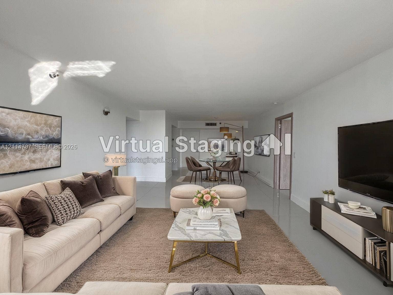 3300 NE 191st Street, #1405, Aventura, Aventura, FL 33180 Open-concept interior featuring smooth-finish ceiling, polished neutral tile flooring, and integrated wall-mounted lighting
