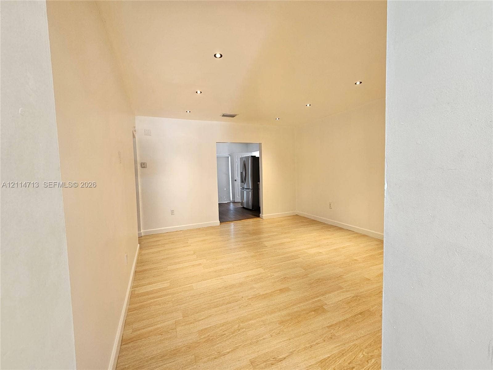 Interior space featuring wood-finish flooring and recessed ceiling lighting