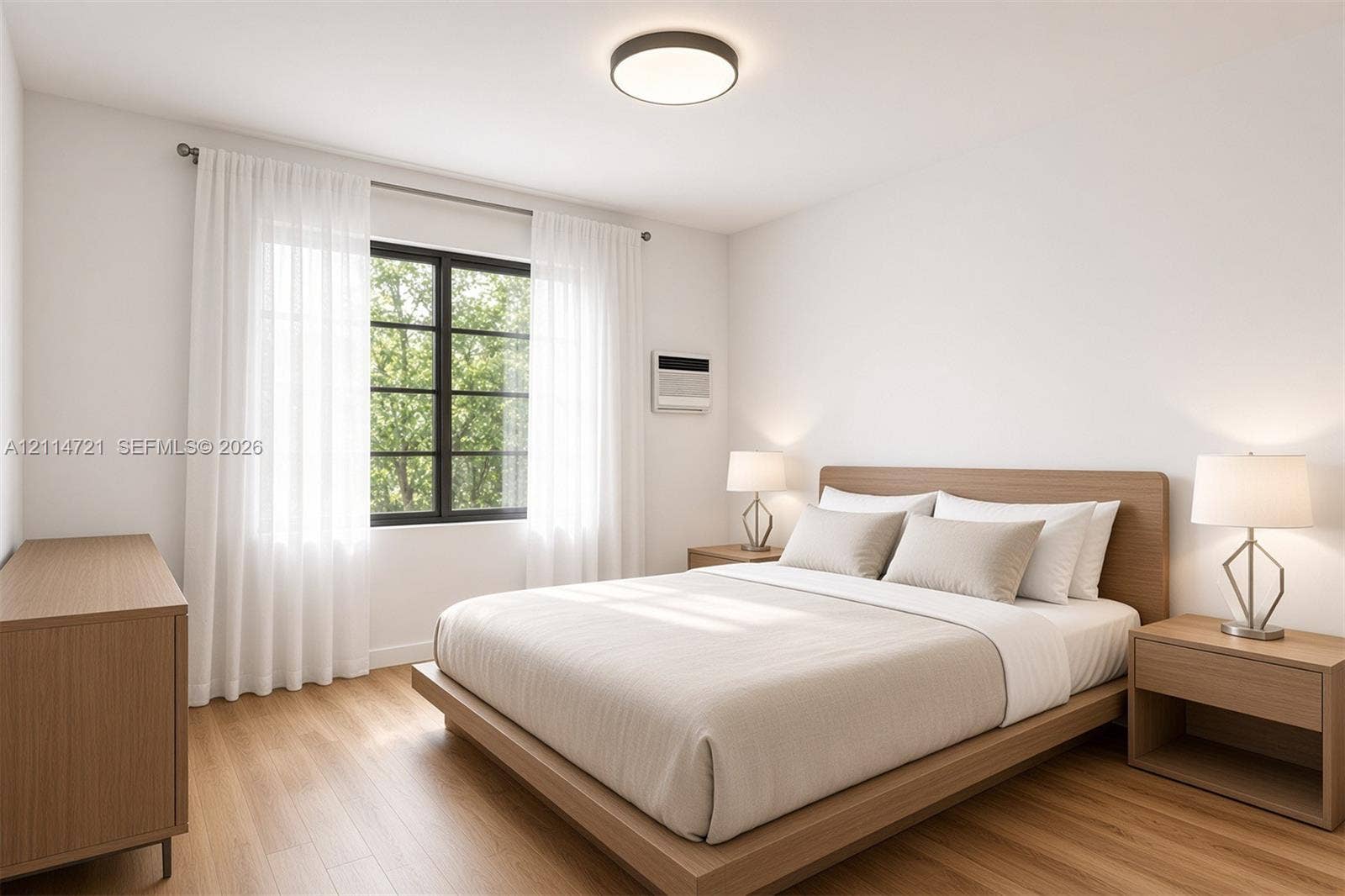 Bedroom featuring wood-finish flooring, a multi-pane window with a black frame, and a flush-mount ceiling light fixture