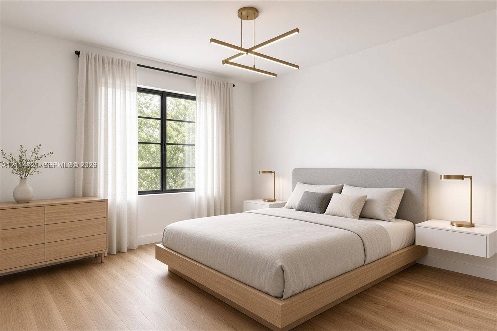 Minimalist bedroom featuring wood-finish flooring, a multi-tiered linear brass pendant light, and black-framed window