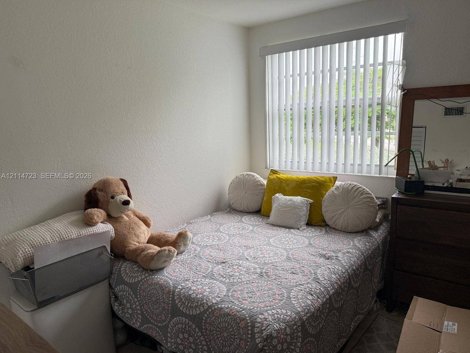 Neutral wall finishes paired with vertical window blinds
