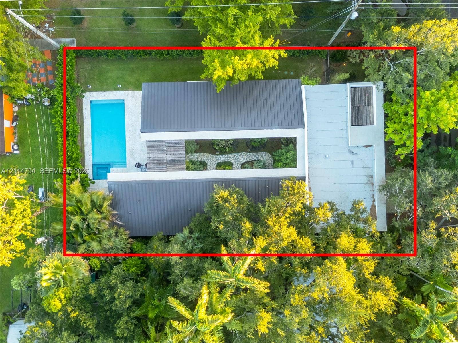 6731 SW 64th Avenue, South Miami, FL 33143 Aerial perspective featuring a heavily wooded residential lot with established mature trees and dense perimeter vegetation