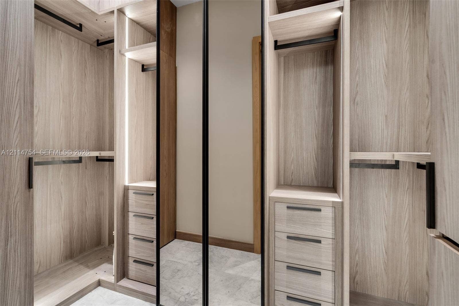 6731 SW 64th Avenue, South Miami, FL 33143 Hallway featuring high-gloss tile flooring, recessed ceiling lighting, linear ceiling diffusers, and wood-finish interior doors