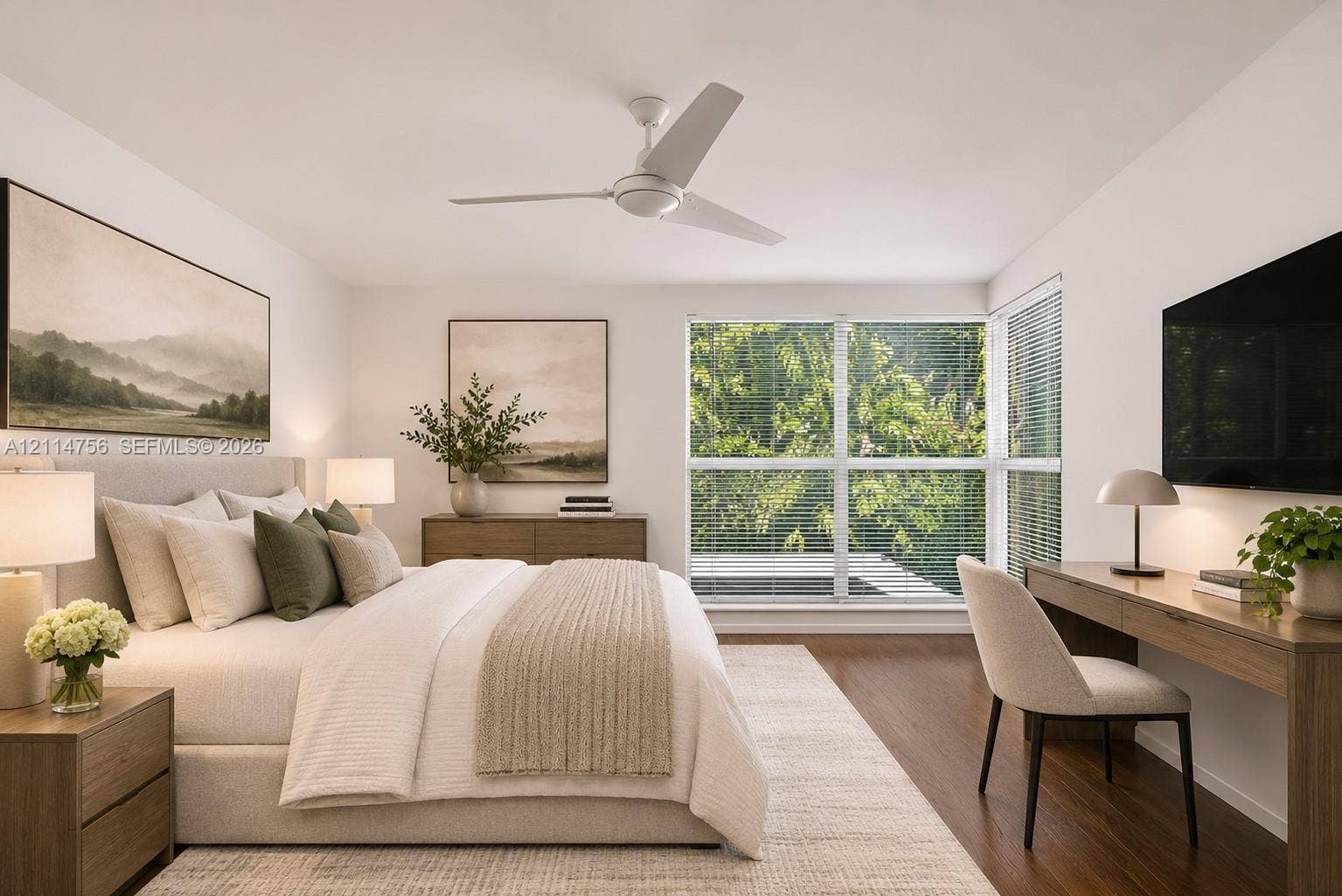 Wood-finish flooring, large windows with horizontal blinds, and a white ceiling fan