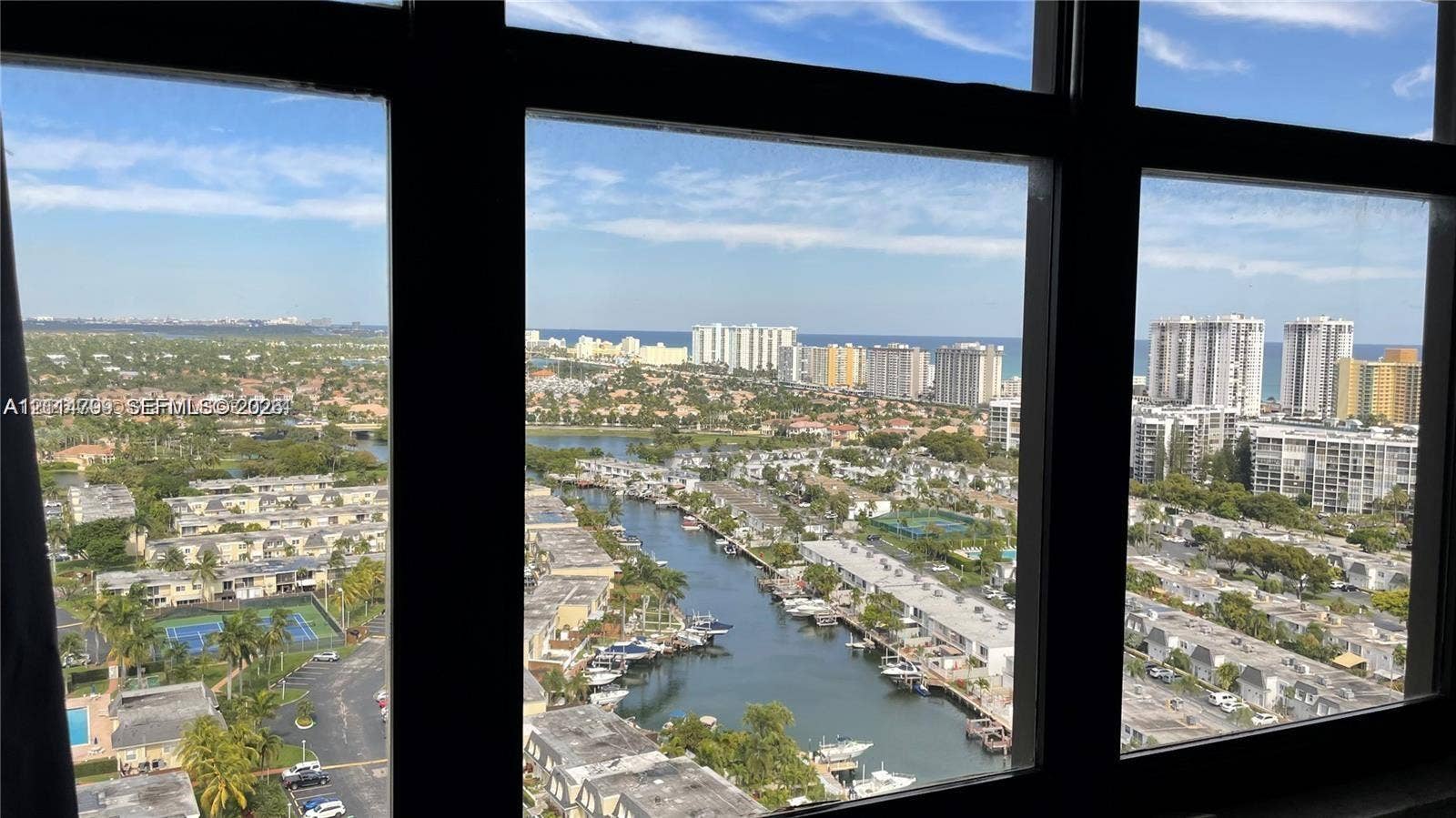 2500 Parkview Drive, #811, Hallandale Beach, Hallandale Beach, FL 33009 Floor-to-ceiling windows featuring panoramic urban, waterway, and coastal scenery