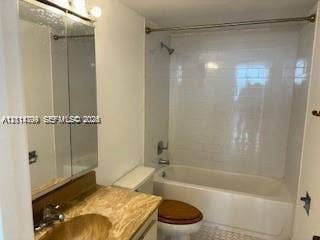 2500 Parkview Drive, #811, Hallandale Beach, Hallandale Beach, FL 33009 Bathroom featuring a bathtub with full-height subway tile surround, a mirrored medicine cabinet, and a stone-finish vanity countertop