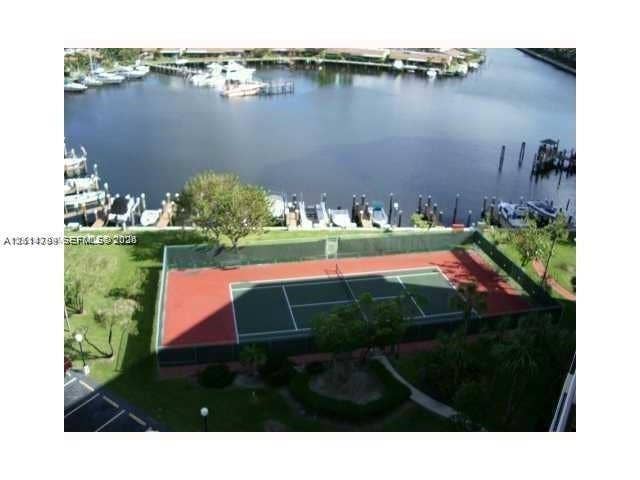 2500 Parkview Drive, #811, Hallandale Beach, Hallandale Beach, FL 33009 Tennis court with perimeter fencing, waterfront location, and boat slips