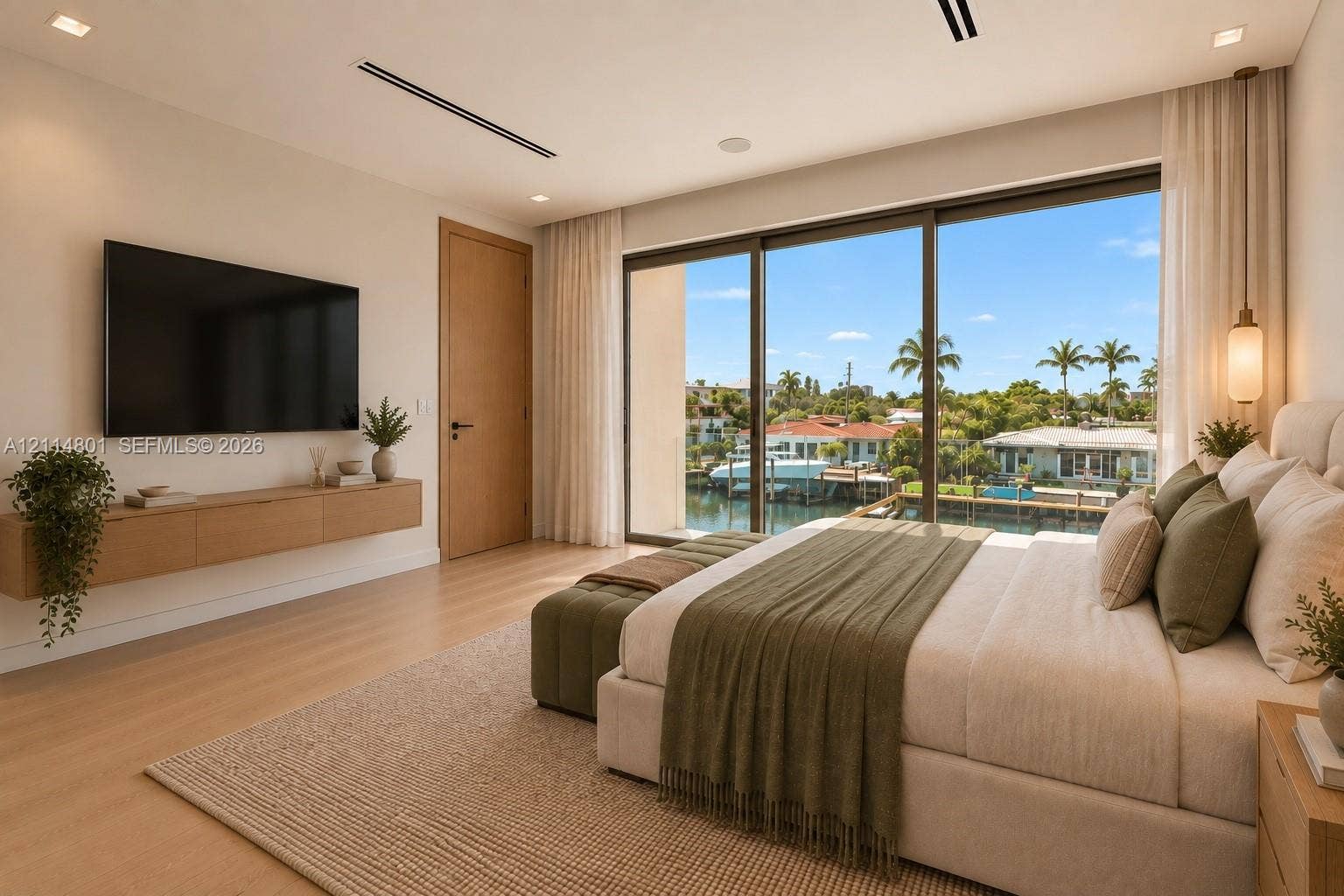 2218 NE 16th Street, Fort Lauderdale, FL 33304 Floor-to-ceiling sliding glass doors, built-in wall-mounted cabinetry, wood-finish flooring, recessed lighting, and integrated ceiling speakers