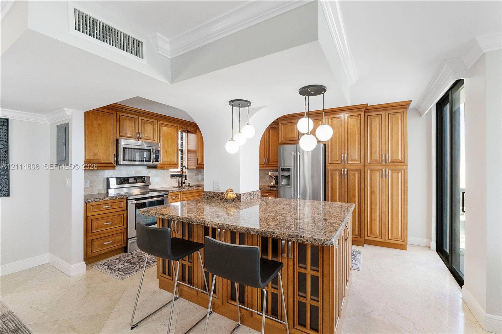 1000 S Ocean Boulevard, #16P, Pompano Beach, Pompano Beach, FL 33062 Kitchen featuring stone countertops, custom cabinetry, a center island, stainless steel appliances, and pendant lighting