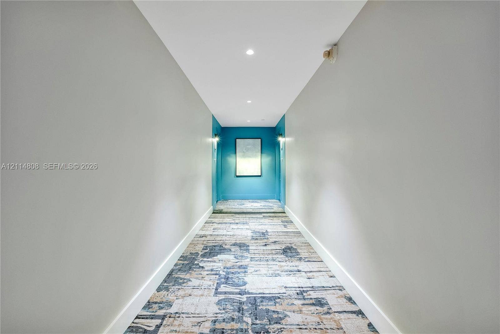 1000 S Ocean Boulevard, #16P, Pompano Beach, Pompano Beach, FL 33062 Hallway featuring neutral-toned walls, patterned textile floor covering, recessed ceiling lighting, and wall-mounted light fixtures
