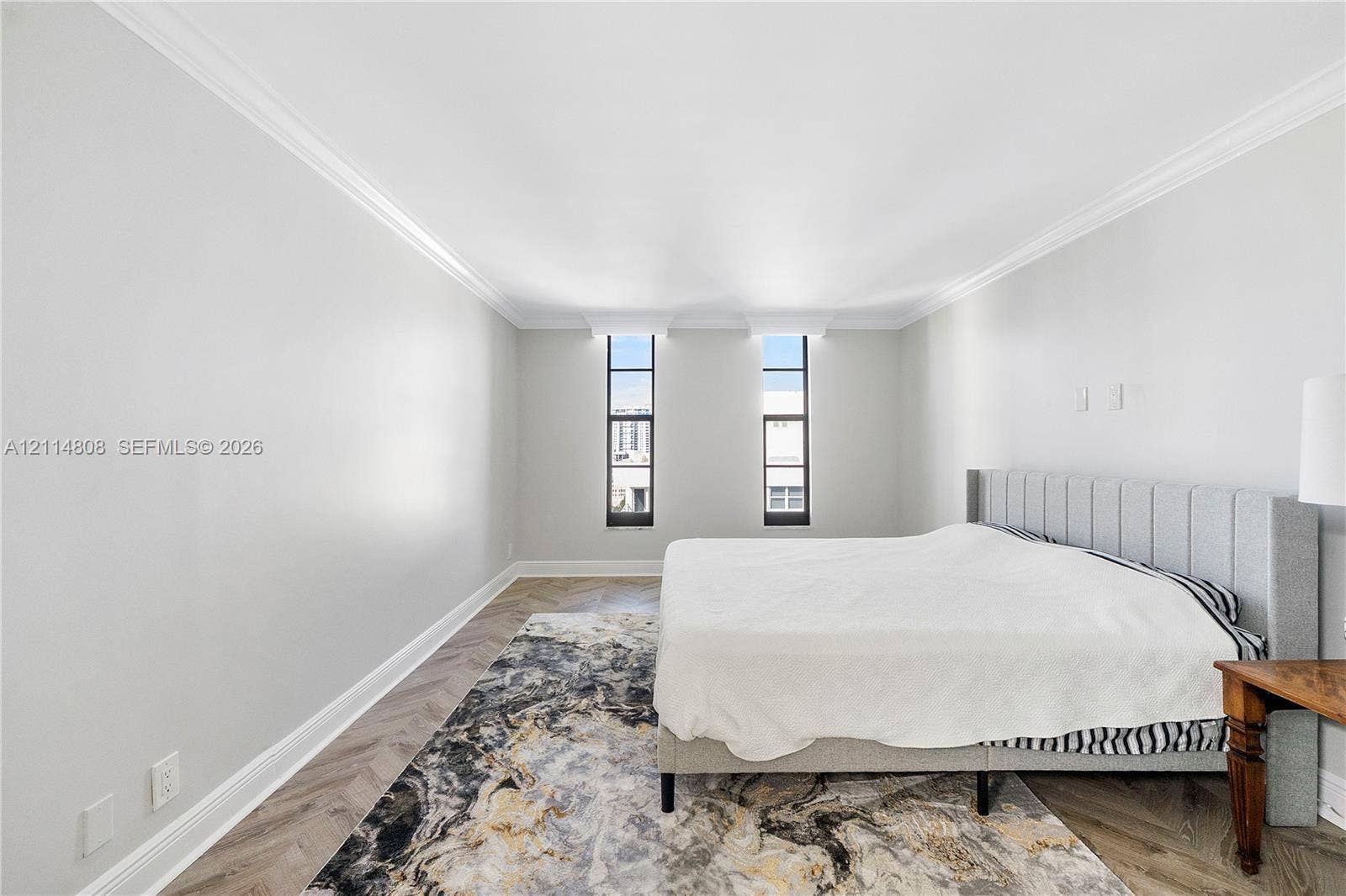 1000 S Ocean Boulevard, #16P, Pompano Beach, Pompano Beach, FL 33062 Herringbone-patterned wood-finish flooring, neutral wall tones, crown molding, and dual tall windows