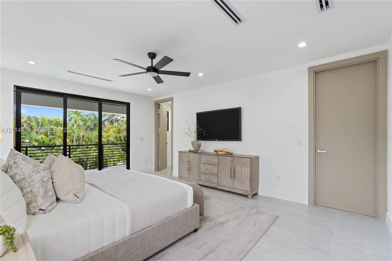 Recessed lighting, ceiling fan, tile flooring, and floor-to-ceiling sliding glass doors with black framing