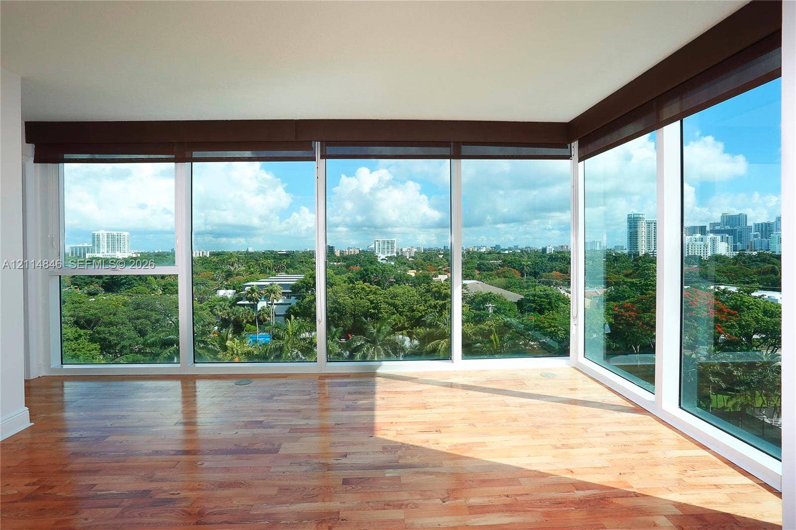 2101 Brickell Avenue, #601, Miami, Miami, FL 33129 Floor-to-ceiling windows, wood-finish flooring, and recessed automated window shades