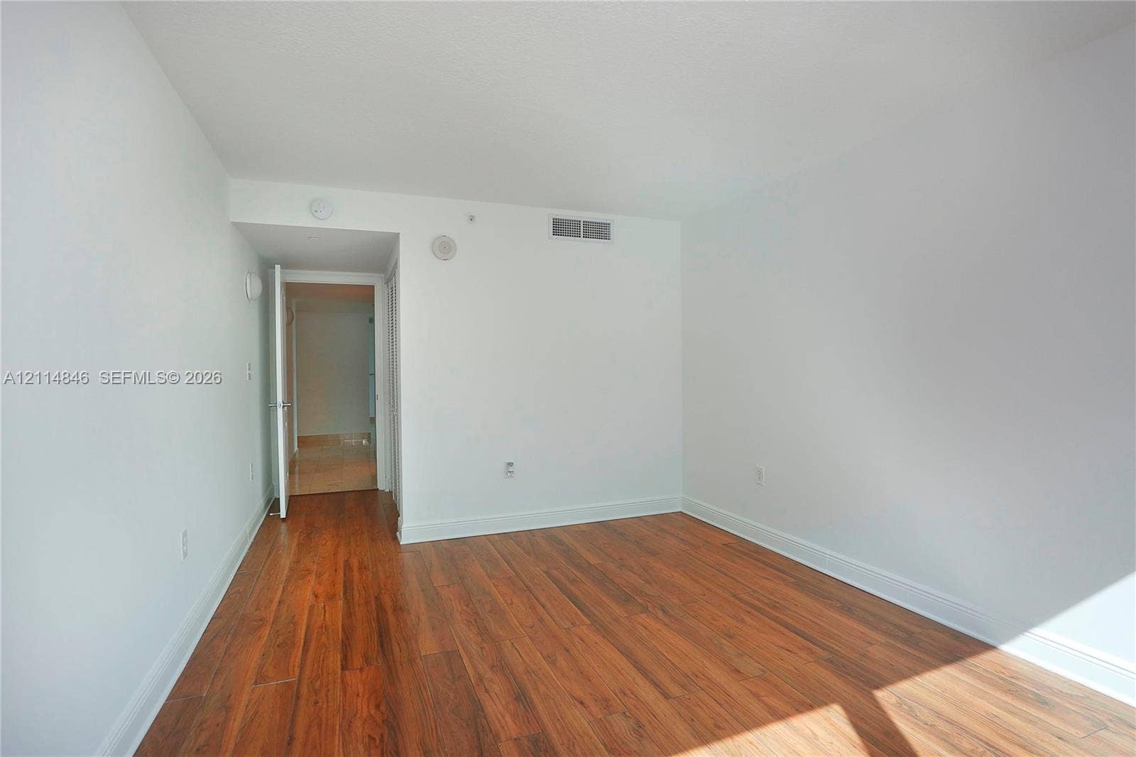 2101 Brickell Avenue, #601, Miami, Miami, FL 33129 Interior space featuring neutral wall paint and wood-finish flooring