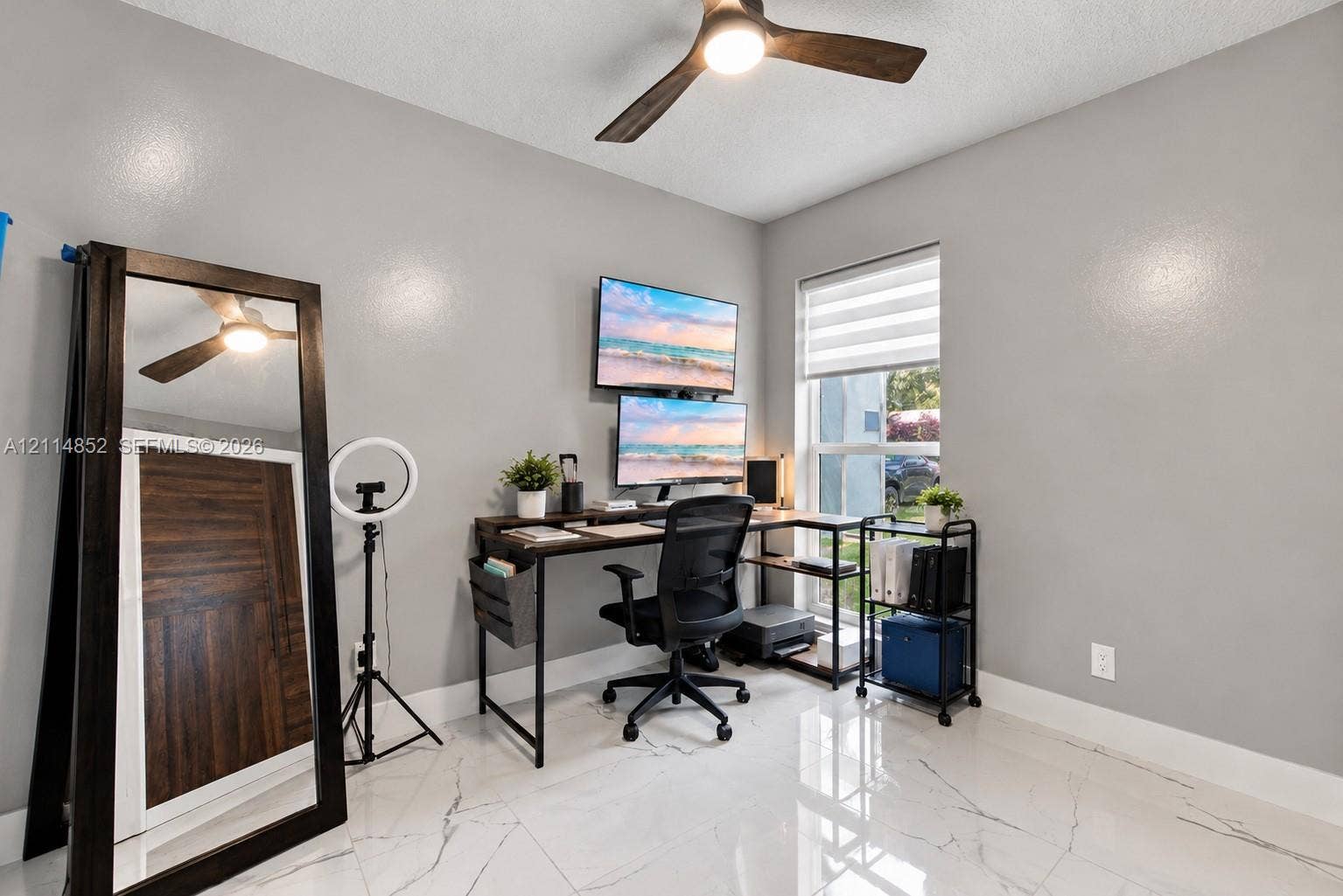 10780 NW 10th Street, Plantation, FL 33322 Polished tile flooring with veining, neutral interior paint, and a modern ceiling fan with integrated lighting