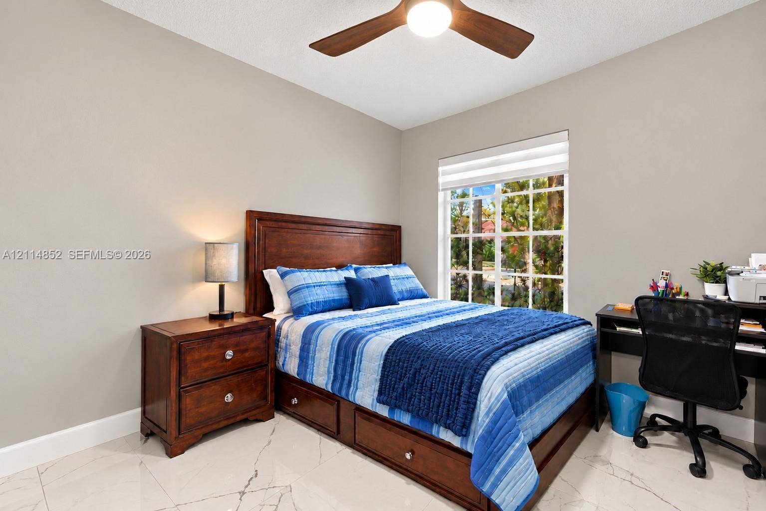 10780 NW 10th Street, Plantation, FL 33322 Neutral wall color, polished stone-finish flooring, and a multi-blade ceiling fan with integrated lighting