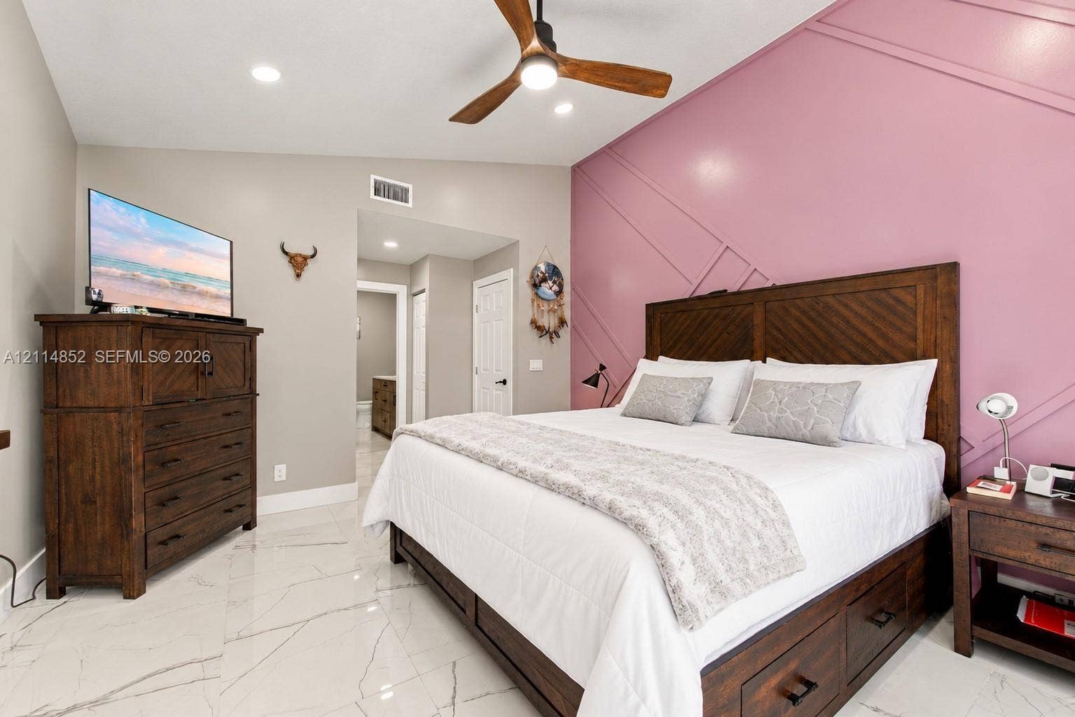 10780 NW 10th Street, Plantation, FL 33322 Geometric wall molding, polished tile flooring, and a modern ceiling fan with integrated lighting