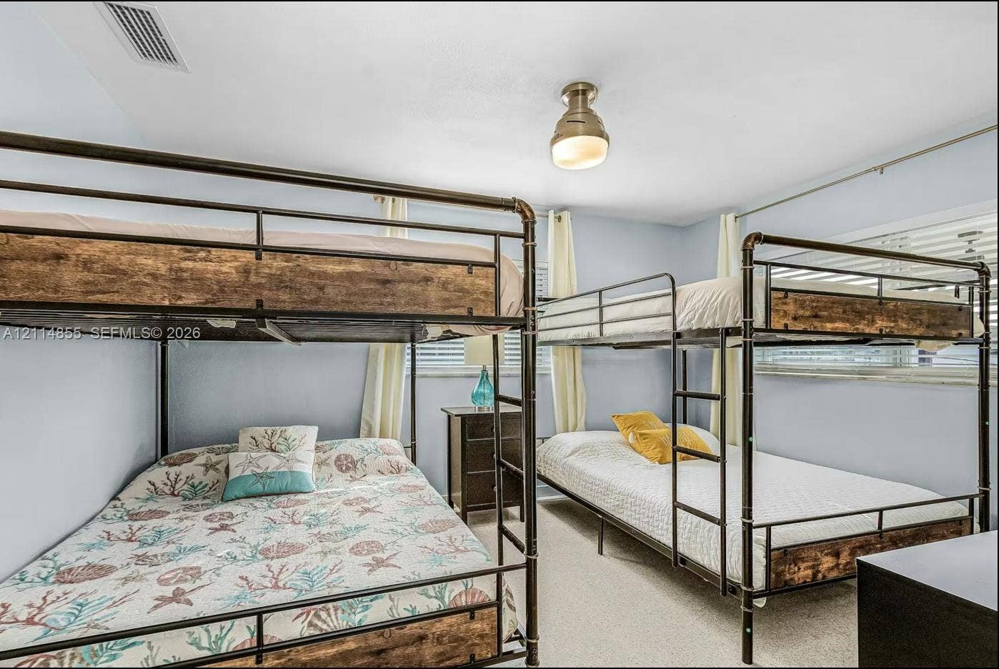 802 Montclair Court, Cape Coral, FL 33904 Neutral-toned walls, carpeting, and a semi-flush mount light fixture