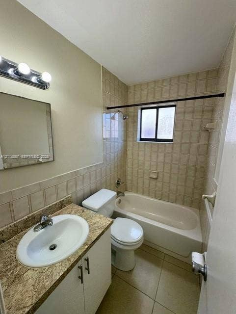 1663 W 41st Street, #1663, Hialeah, Hialeah, FL 33012 Full bathroom featuring a stone-finish countertop with an integrated oval sink, square-tile wall surround, bathtub-shower combination, and polished chrome fixtures