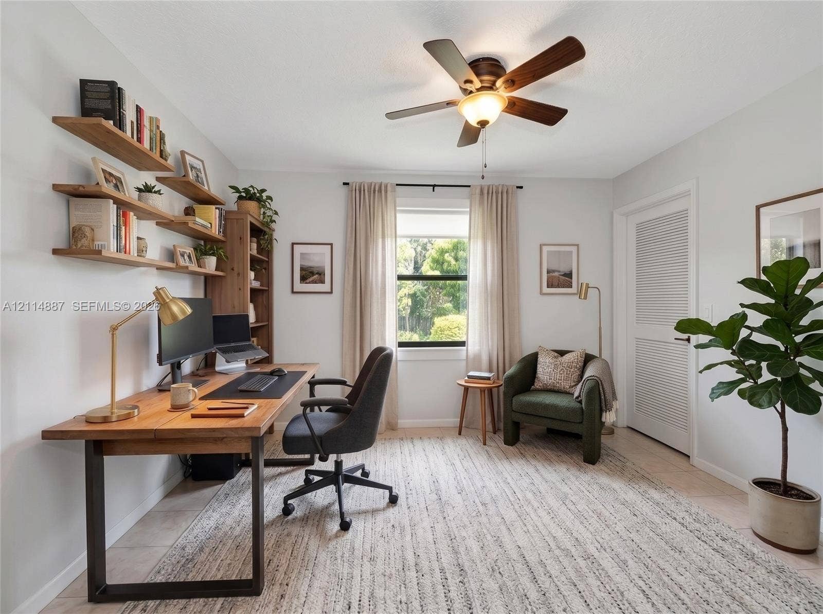 5722 Aspen Ridge Circle, Delray Beach, FL 33484 Wall-mounted natural wood shelving, ceiling fan with integrated lighting, and louvered door