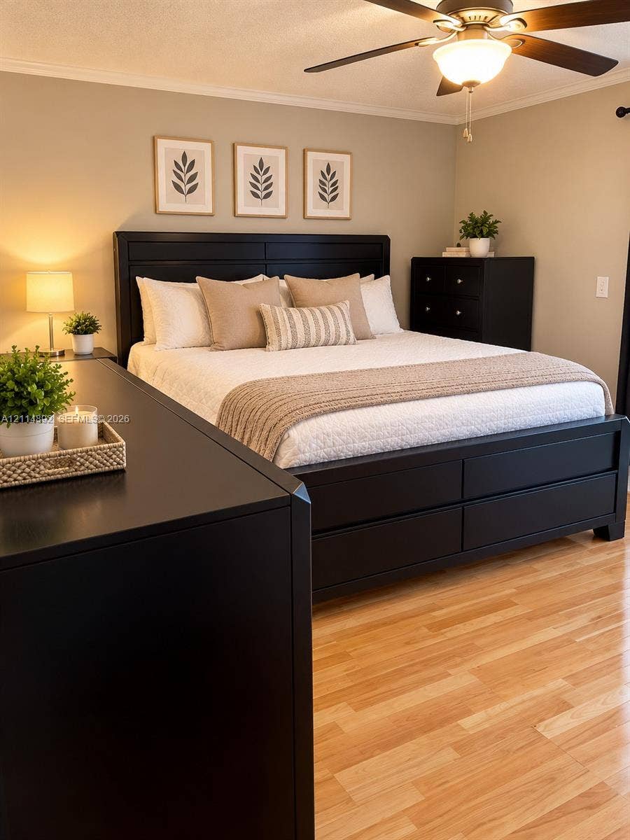 582 Durham U, #582, Deerfield Beach, FL 33442 Neutral-toned walls paired with wood-finish flooring and a ceiling-mounted light fixture with a central fan
