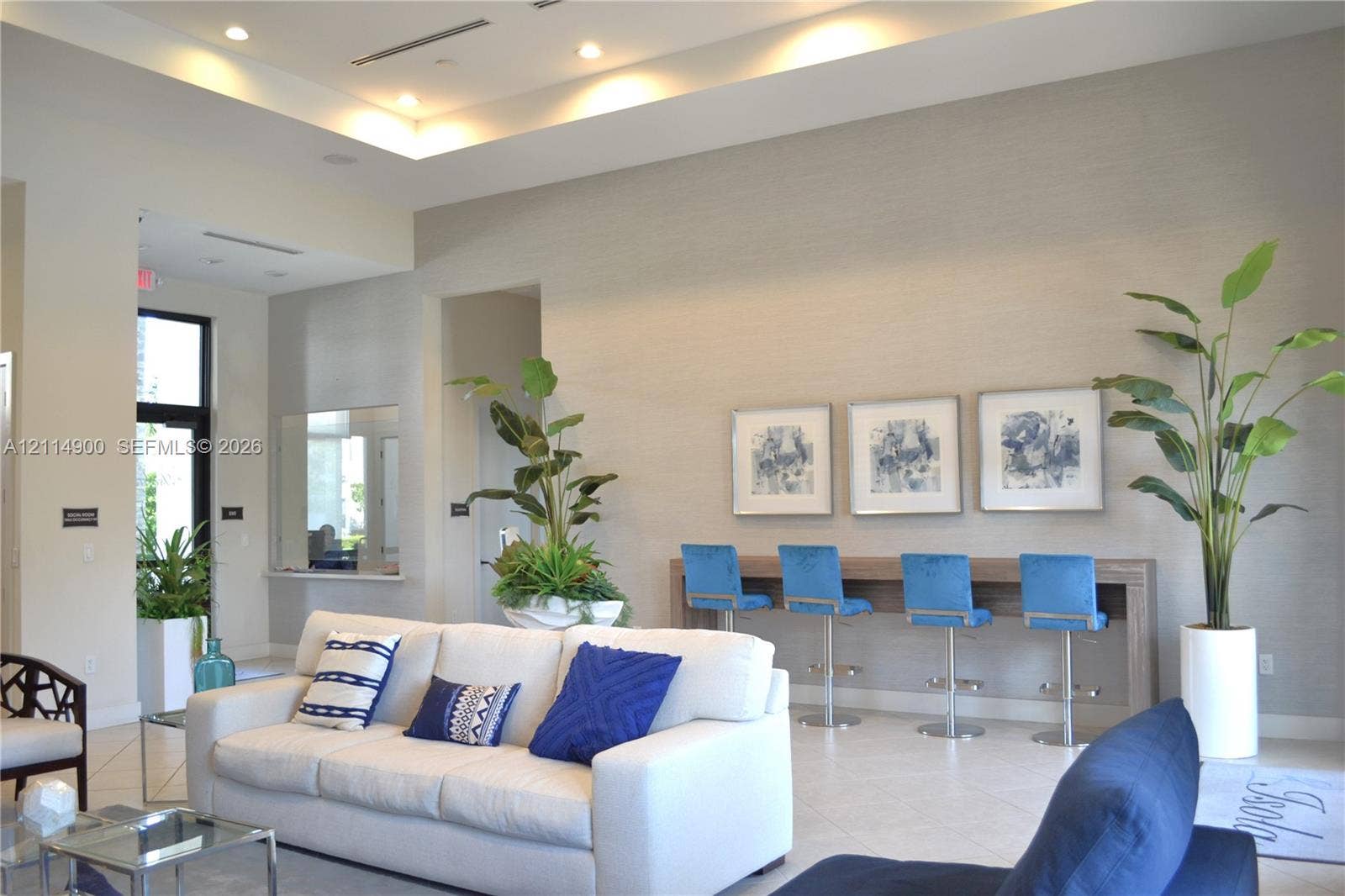 25048 SW 113th Place, Homestead, FL 33032 Tray ceiling with integrated lighting, textured wall finishes, recessed lighting, and large-format tile flooring