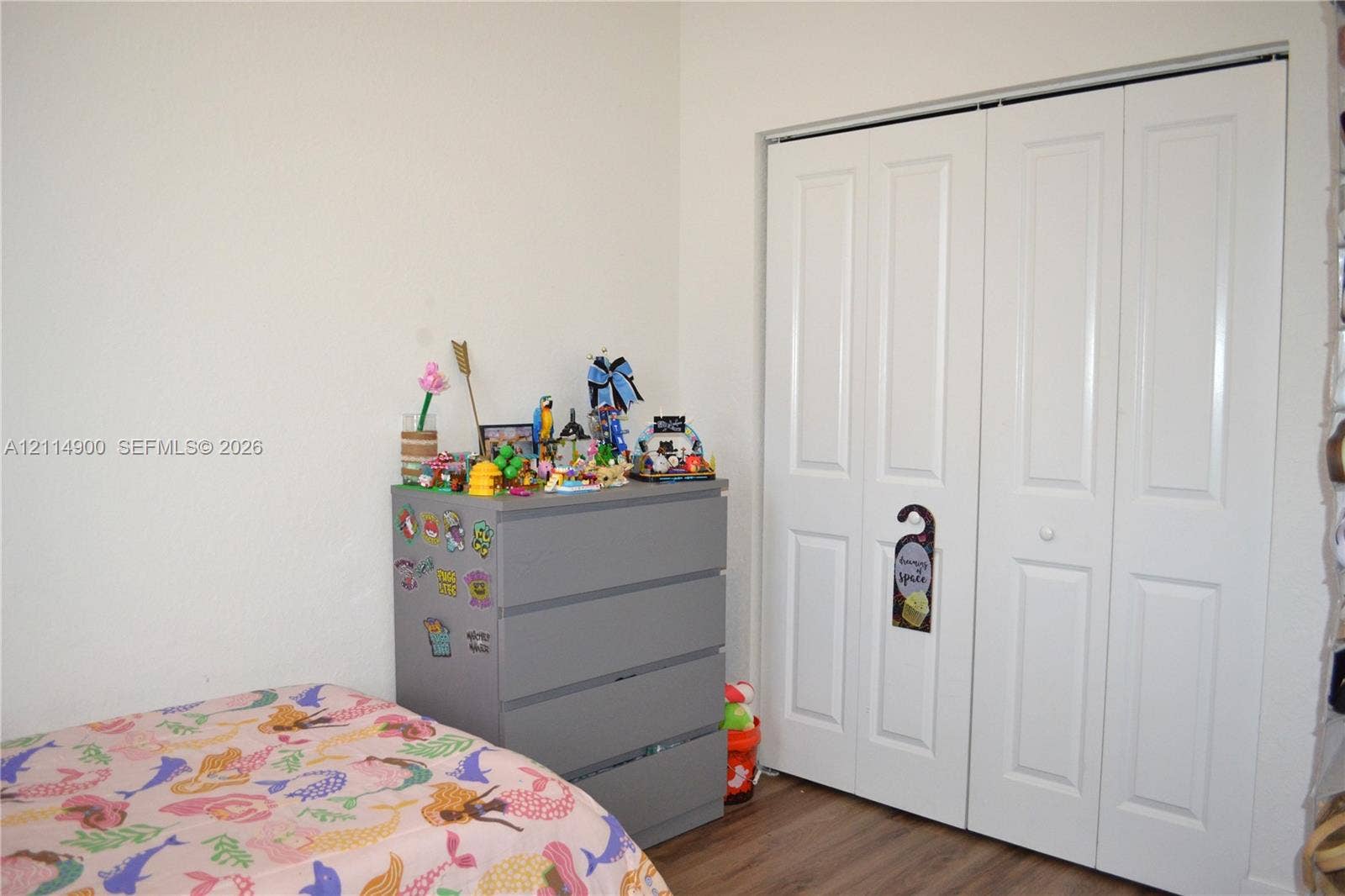 25048 SW 113th Place, Homestead, FL 33032 Bi-fold closet doors with white finish and wood-finish flooring