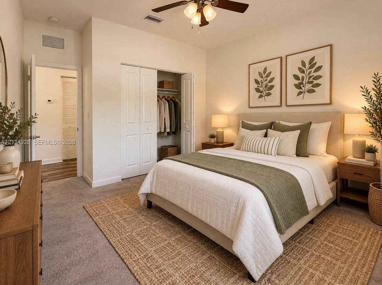 1411 SE 26th Road, Homestead, FL 33035 Neutral carpeting, ceiling fan with integrated lighting, and dual-door closet featuring built-in shelving