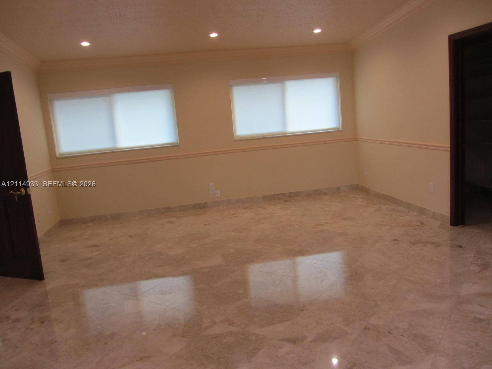 1001 Bella Vista Avenue, Coral Gables, Coral Gables, FL 33156 upstairs bedroom.Polished stone tile flooring, recessed ceiling lighting, crown molding, chair rail molding, and solid wood interior doors