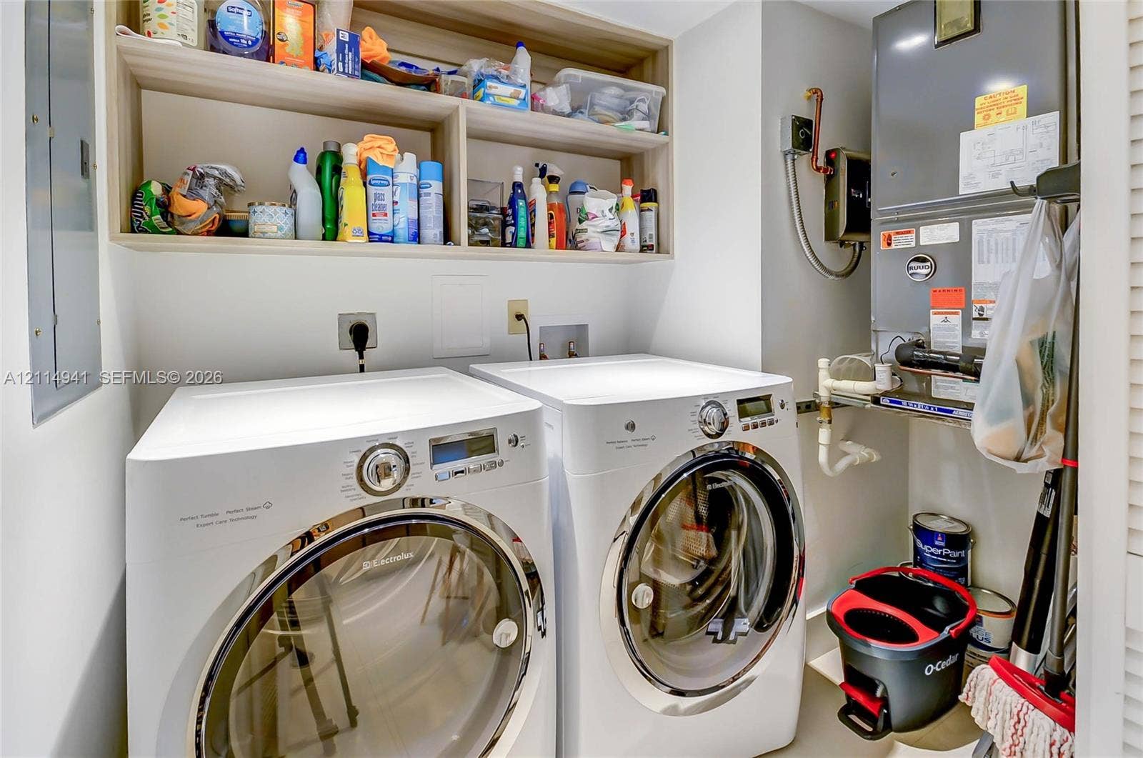 16175 Golf Club Road, #113, Weston, FL 33326 Built-in wood-finish overhead shelving and high-efficiency appliance hookups
