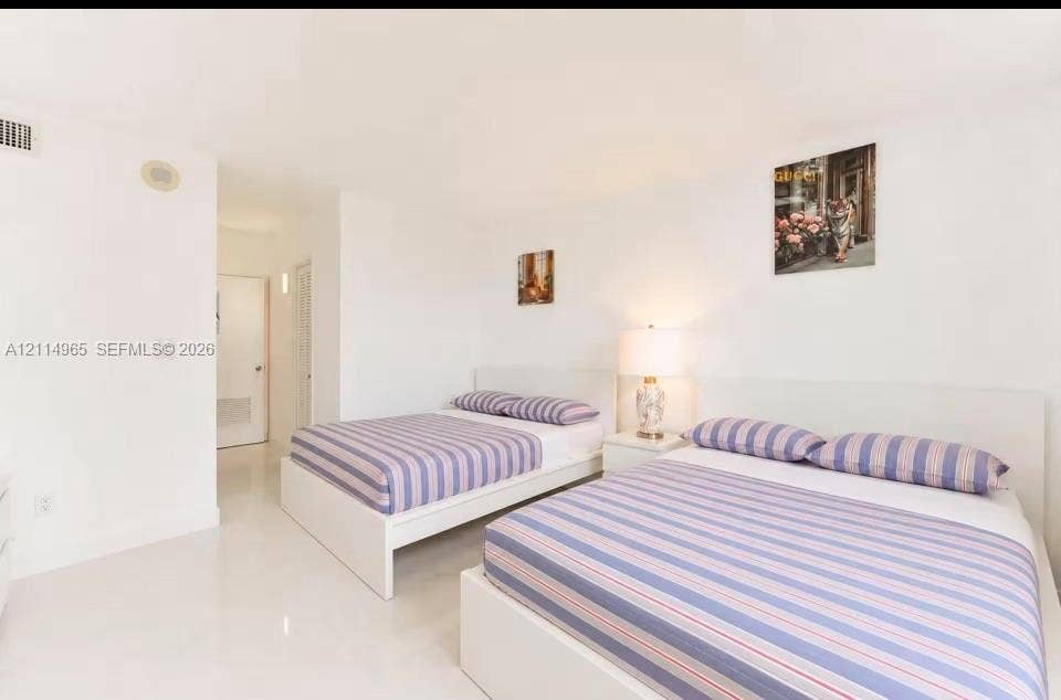 19370 Collins Avenue, #414, Sunny Isles Beach, FL 33160 Spacious room featuring high-gloss tile flooring, smooth ceilings, and white wall finishes