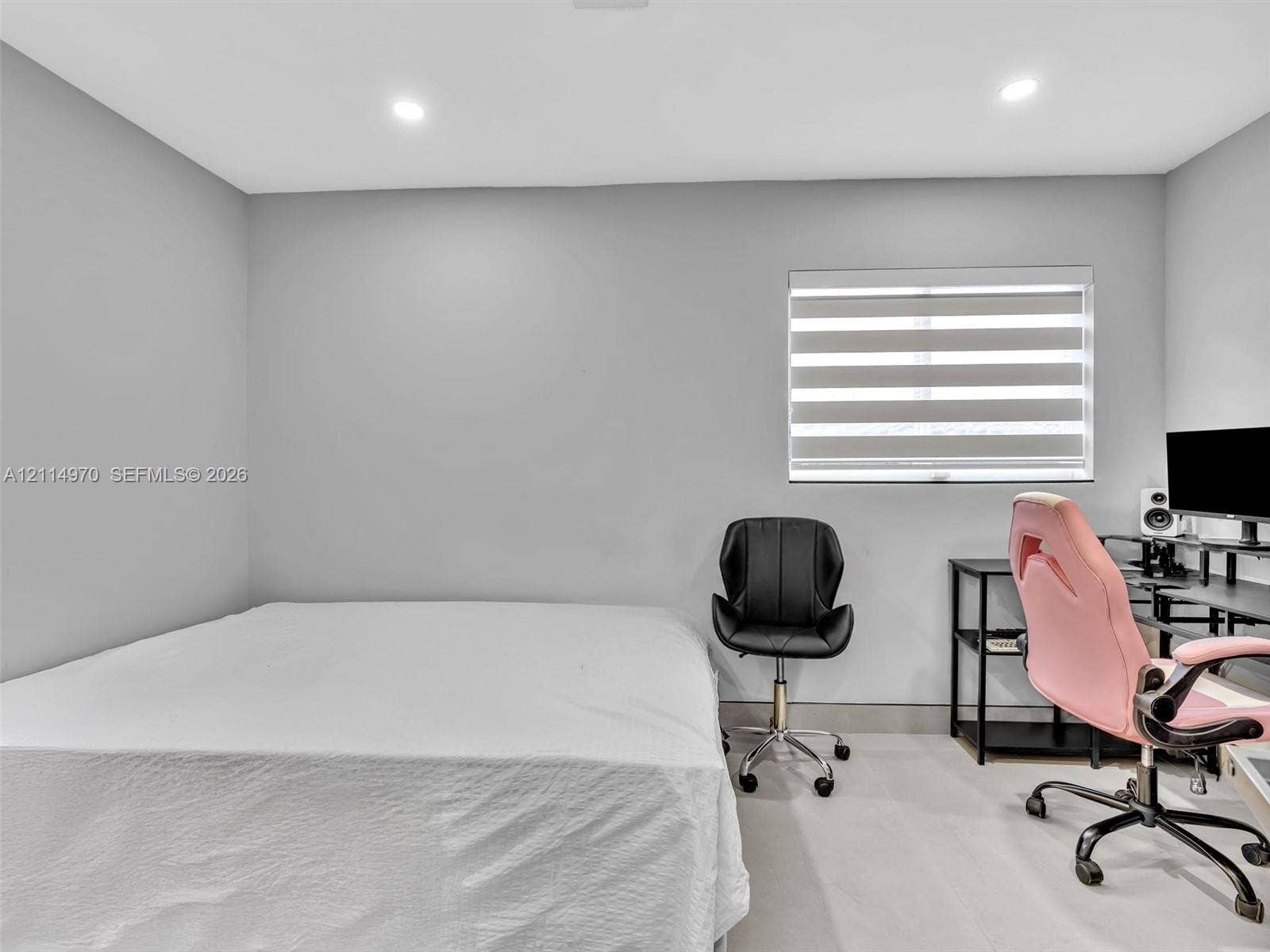4204 Van Buren Street, Hollywood, Hollywood, FL 33021 Neutral interior space featuring smooth walls, recessed ceiling lighting, light-toned flooring, and a window equipped with banded roller shades