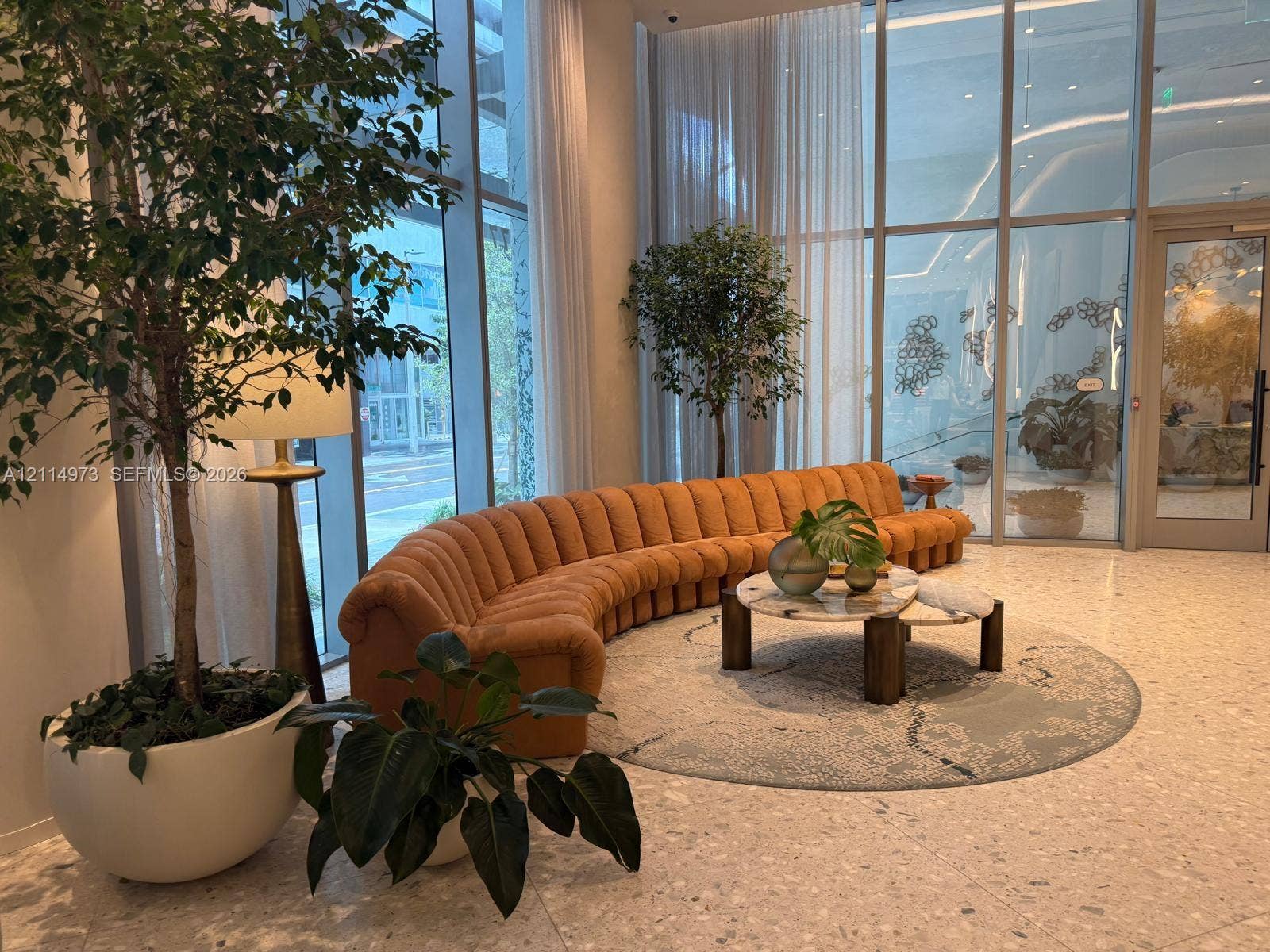 77 SE 5th Street, #2406, Miami, FL 33131 Floor-to-ceiling glass curtain walls, terrazzo flooring, and double-height ceilings