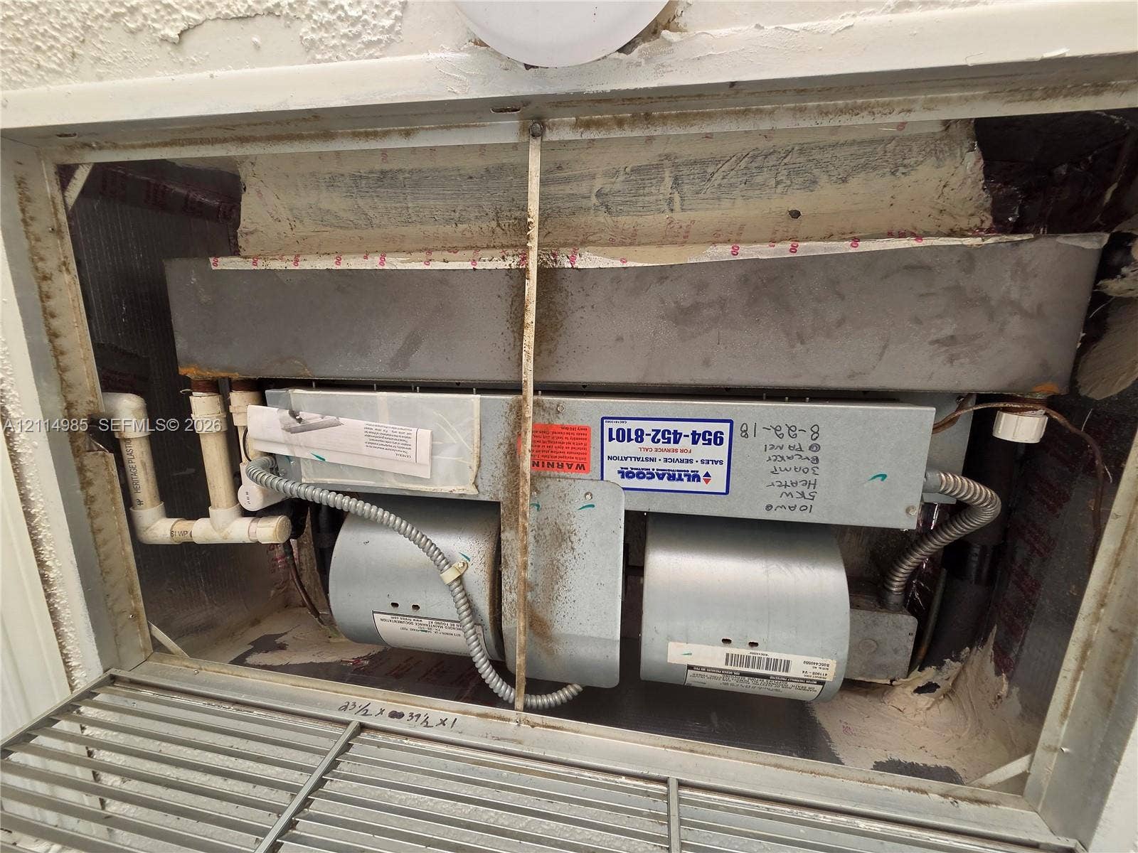 9441 Live Oak Place, #308, Davie, Davie, FL 33324 Built-in air handling unit featuring a dual-blower assembly, rigid metal housing, and PVC piping connections