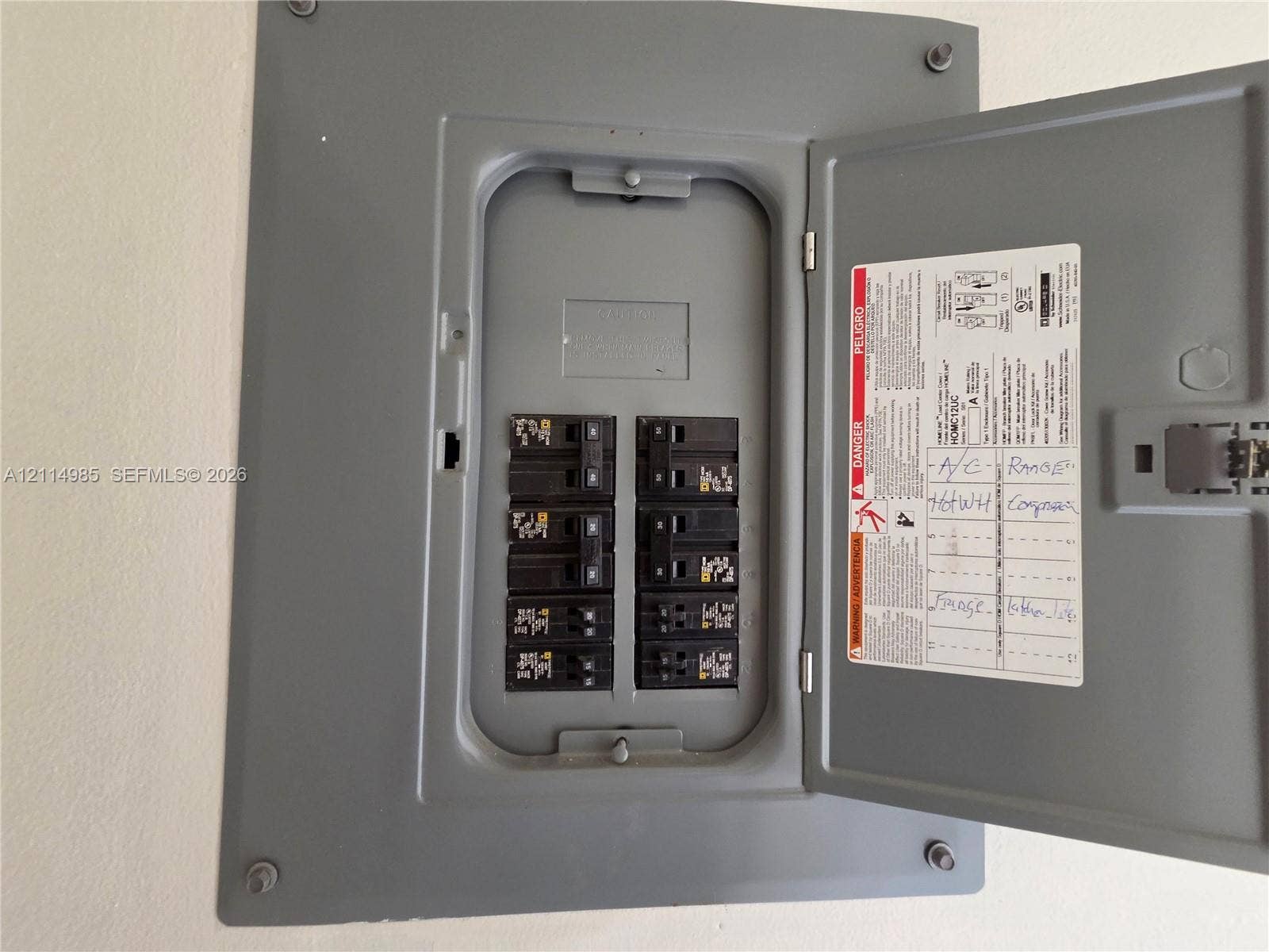 9441 Live Oak Place, #308, Davie, Davie, FL 33324 Electrical panel featuring a gray metal enclosure with a hinged door and multiple circuit breakers
