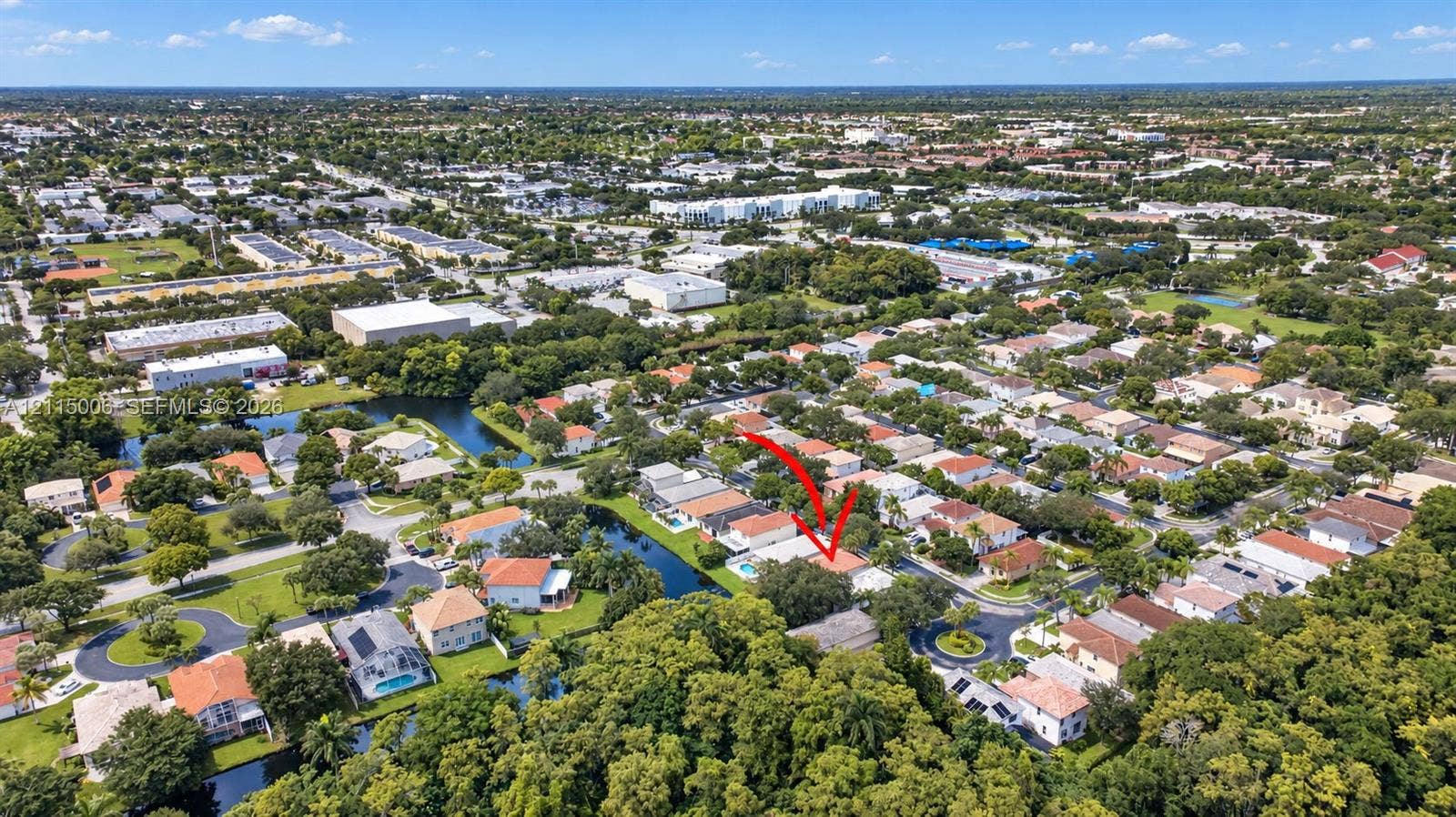 4812 NW 19th Street, Coconut Creek, FL 33063 Aerial perspective of a residential property featuring a backyard swimming pool and a water-side location