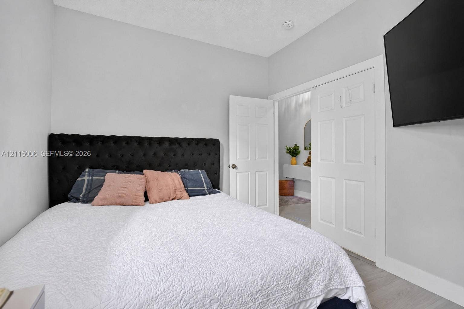 4812 NW 19th Street, Coconut Creek, FL 33063 Neutral wall tones, wood-finish flooring, and six-panel interior doors