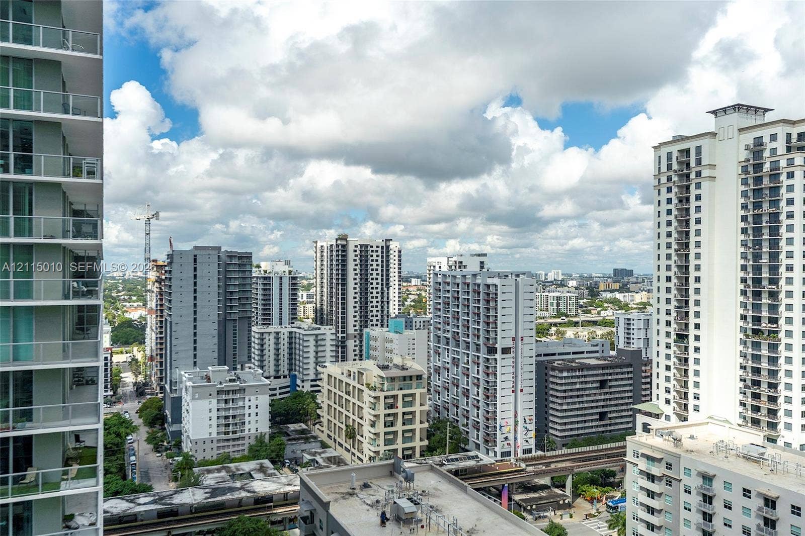 1100 S Miami Avenue, #2407, Miami, FL 33130 High-rise balcony featuring glass-panel railings and an expansive urban cityscape