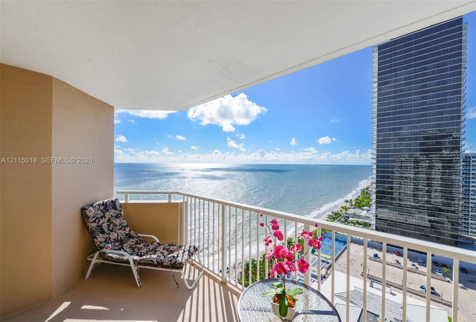 1950 S Ocean Drive, #20N, Hallandale Beach, FL 33009 Covered private balcony featuring white metal railing and expansive ocean and coastal shoreline scenery