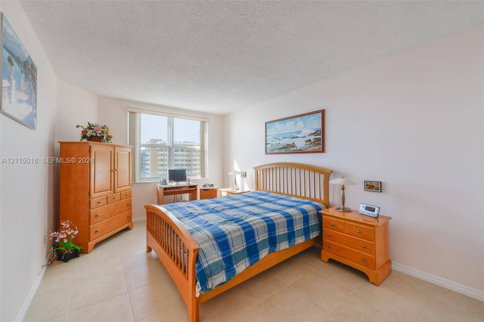 1950 S Ocean Drive, #20N, Hallandale Beach, FL 33009 Neutral-toned tile flooring, light-colored walls, and a large window providing natural light