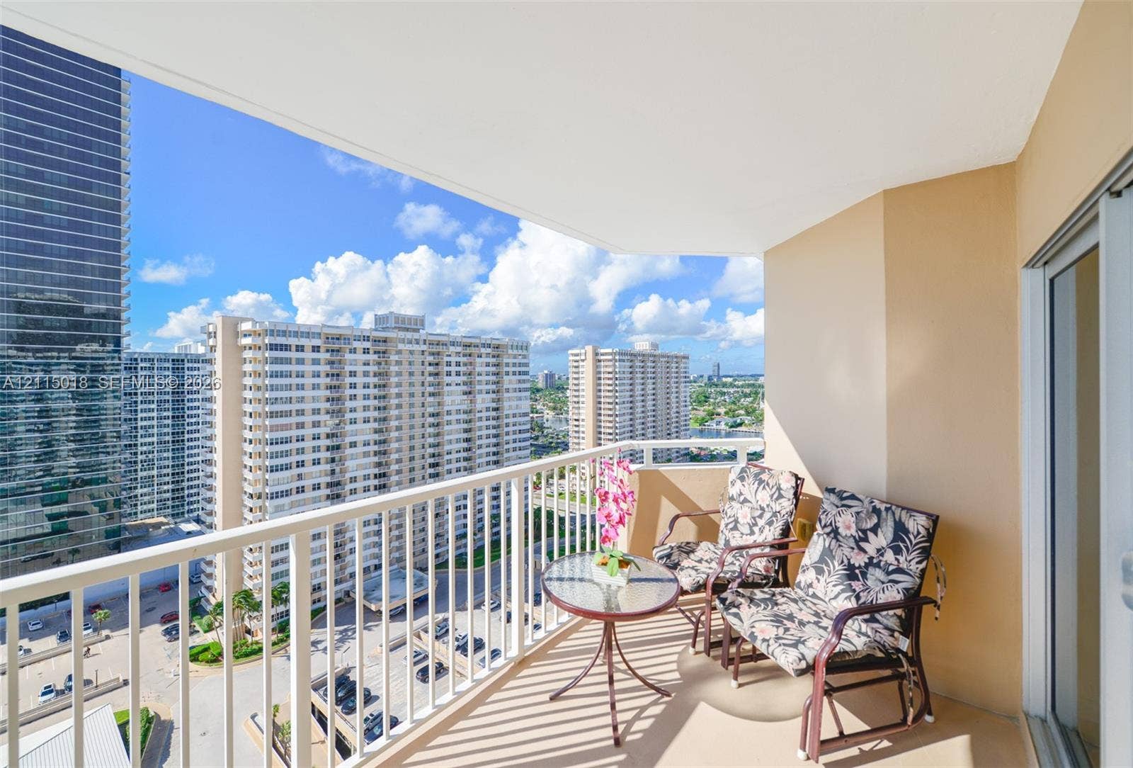1950 S Ocean Drive, #20N, Hallandale Beach, FL 33009 Private balcony featuring white metal railings and concrete flooring with urban scenery