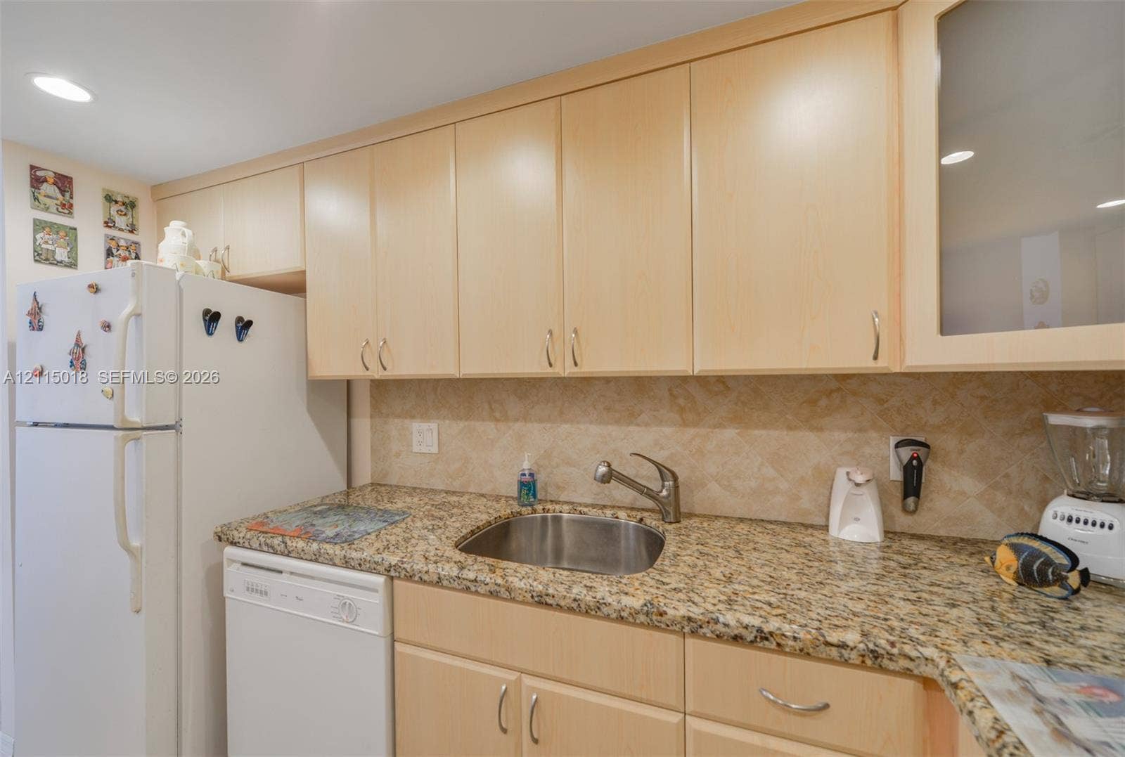 1950 S Ocean Drive, #20N, Hallandale Beach, FL 33009 Flat-panel cabinetry, stone countertops, stainless steel undermount sink, recessed lighting, and tile backsplash