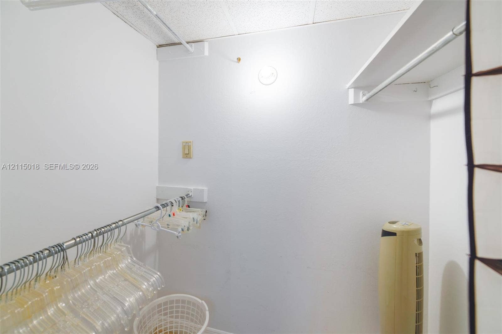 1950 S Ocean Drive, #20N, Hallandale Beach, FL 33009 Walk-in closet featuring multi-level metal garment rods and built-in white shelving