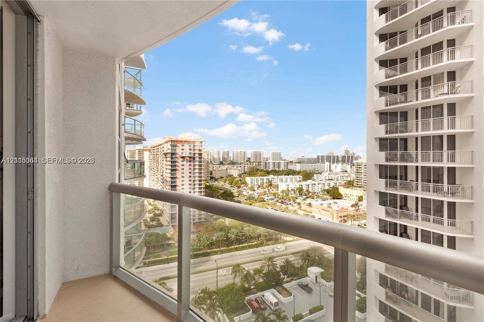 17315 Collins Avenue, #1808, Sunny Isles Beach, FL 33160 Private balcony featuring a glass-panel railing and concrete flooring