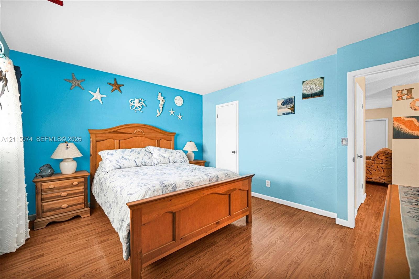 Wood-finish flooring and interior doors with brushed metal hardware
