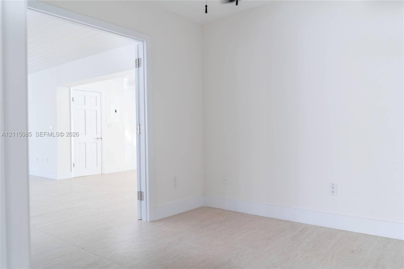 663 Woodcrest Road, Key Biscayne, Key Biscayne, FL 33149 Neutral-toned walls, light-toned porcelain tile flooring, and a six-panel interior door