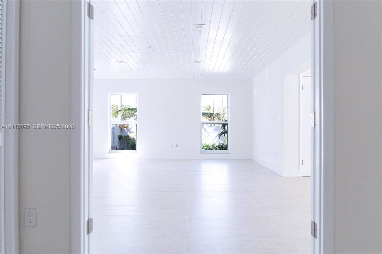 663 Woodcrest Road, Key Biscayne, Key Biscayne, FL 33149 Plank-style ceiling, light-toned porcelain tile flooring, and dual picture windows