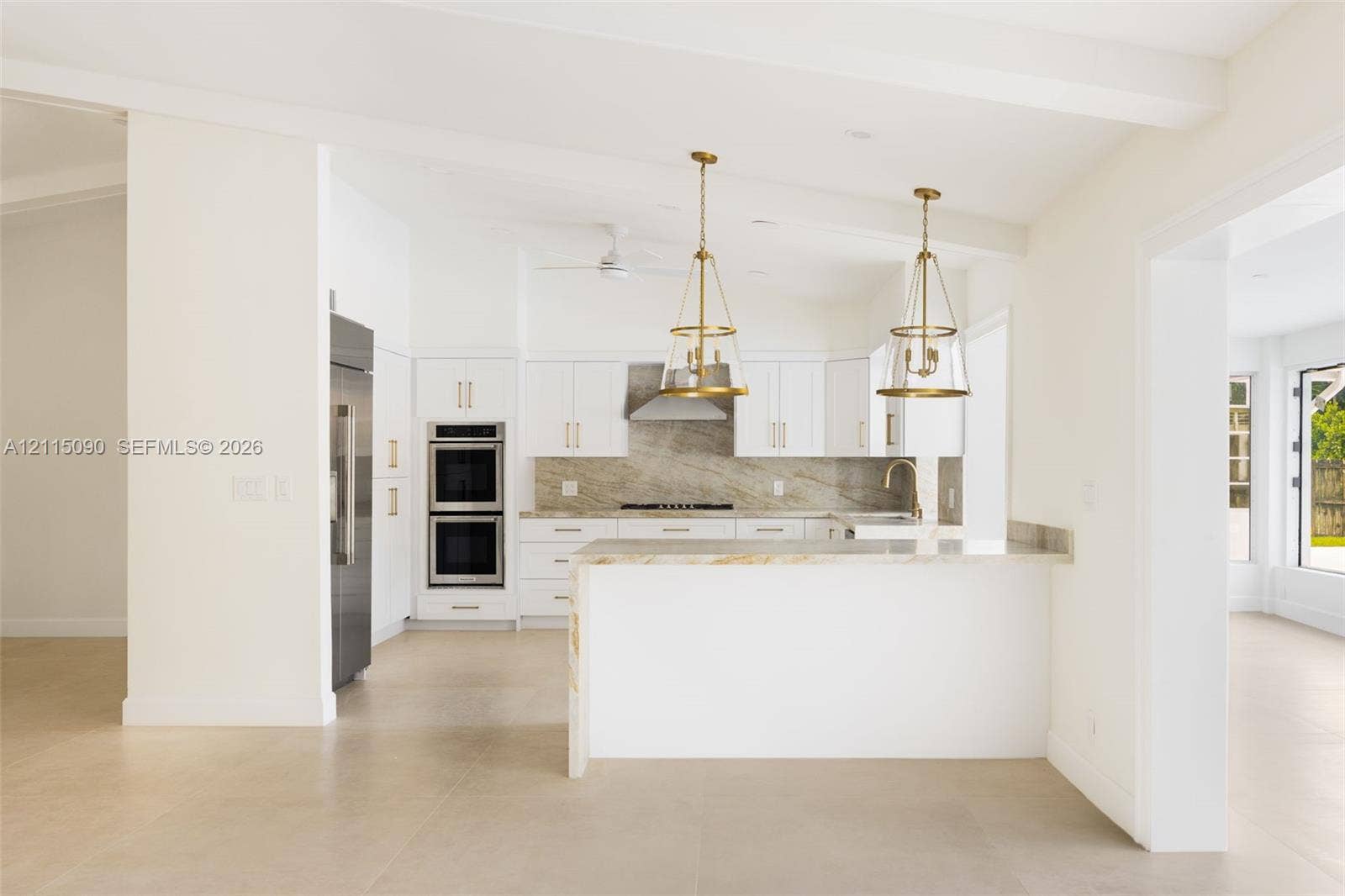 12900 SW 71st Avenue, Pinecrest, Pinecrest, FL 33156 Kitchen featuring white shaker-style cabinetry, stone-surface countertops, dual stainless steel wall ovens, stone-finish backsplash, and pendant lighting